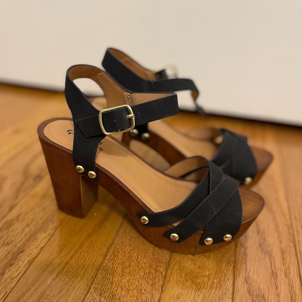 Black and brown heals with wooden soles